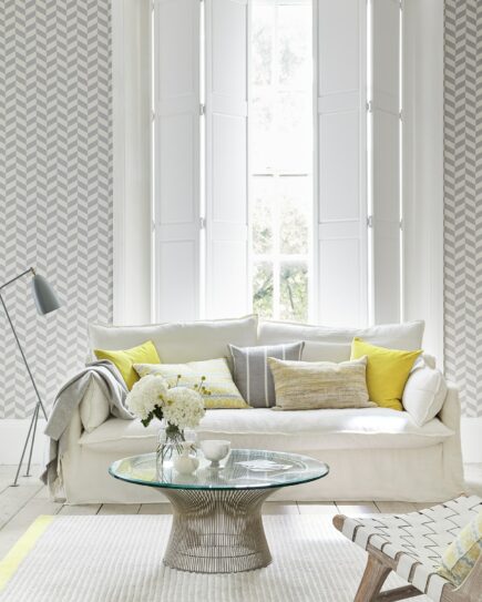 Grey and yellow lounge with white shutters