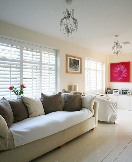 white living room full height shutters